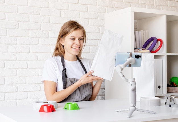 happy student showing embroidery hoop